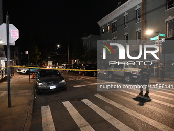 Police investigate the crime scene where a 26-year-old man is shot in the Highland Park section of Brooklyn, New York, United States, on Sep...