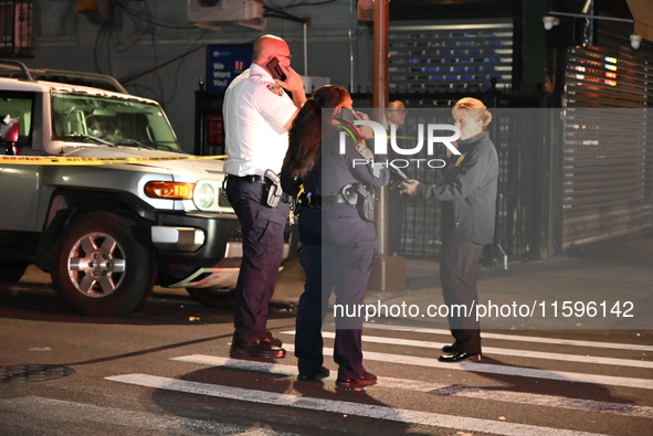 Police investigate the crime scene where a 26-year-old man is shot in the Highland Park section of Brooklyn, New York, United States, on Sep...