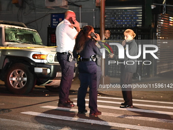 Police investigate the crime scene where a 26-year-old man is shot in the Highland Park section of Brooklyn, New York, United States, on Sep...