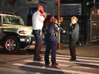 Police investigate the crime scene where a 26-year-old man is shot in the Highland Park section of Brooklyn, New York, United States, on Sep...