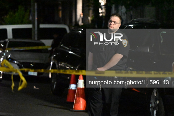 Police investigate the crime scene where a 26-year-old man is shot in the Highland Park section of Brooklyn, New York, United States, on Sep...