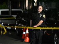 Police investigate the crime scene where a 26-year-old man is shot in the Highland Park section of Brooklyn, New York, United States, on Sep...