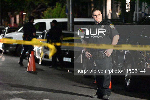 Police investigate the crime scene where a 26-year-old man is shot in the Highland Park section of Brooklyn, New York, United States, on Sep...