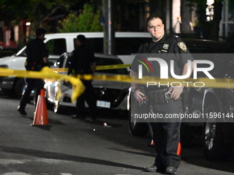 Police investigate the crime scene where a 26-year-old man is shot in the Highland Park section of Brooklyn, New York, United States, on Sep...