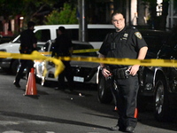 Police investigate the crime scene where a 26-year-old man is shot in the Highland Park section of Brooklyn, New York, United States, on Sep...