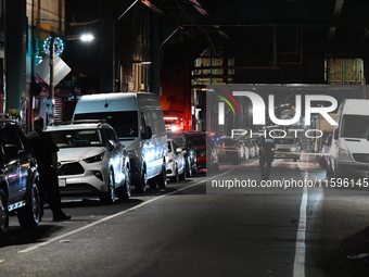 Police investigate the crime scene where a 26-year-old man is shot in the Highland Park section of Brooklyn, New York, United States, on Sep...