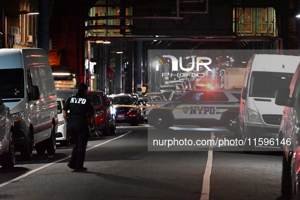 Police investigate the crime scene where a 26-year-old man is shot in the Highland Park section of Brooklyn, New York, United States, on Sep...