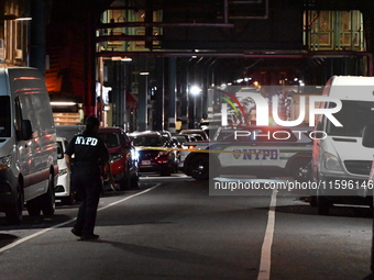 Police investigate the crime scene where a 26-year-old man is shot in the Highland Park section of Brooklyn, New York, United States, on Sep...