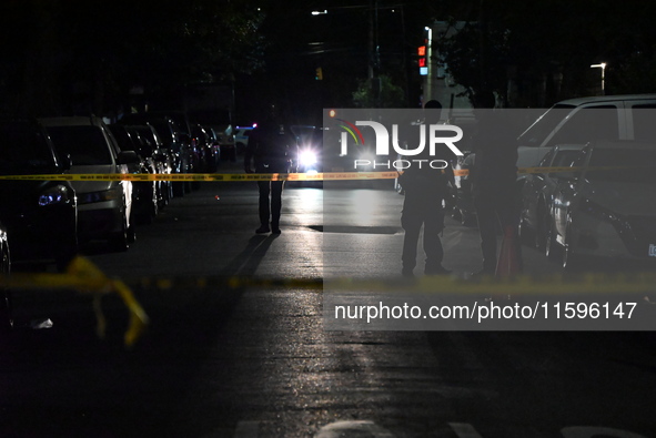 Police investigate the crime scene where a 26-year-old man is shot in the Highland Park section of Brooklyn, New York, United States, on Sep...