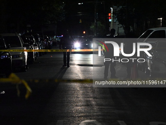 Police investigate the crime scene where a 26-year-old man is shot in the Highland Park section of Brooklyn, New York, United States, on Sep...