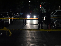 Police investigate the crime scene where a 26-year-old man is shot in the Highland Park section of Brooklyn, New York, United States, on Sep...