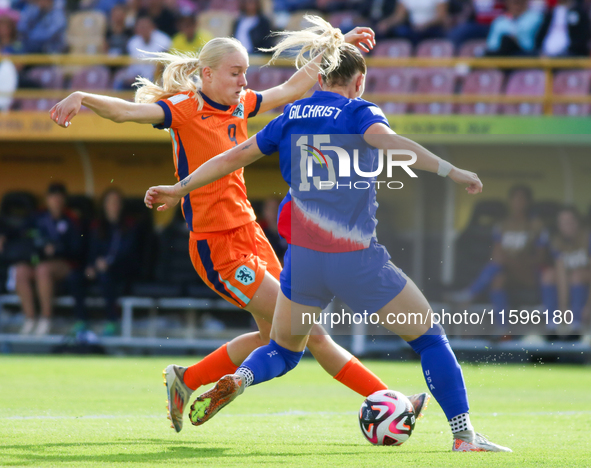 Heather Suzanne Gilchrist of the United States and Bo van Egmond of the Netherlands fight for the ball during the FIFA U-20 Women's World Cu...