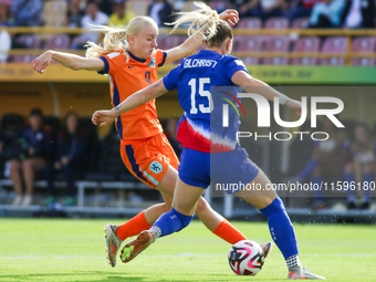 Heather Suzanne Gilchrist of the United States and Bo van Egmond of the Netherlands fight for the ball during the FIFA U-20 Women's World Cu...