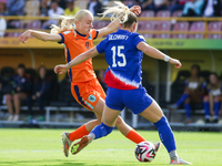 Heather Suzanne Gilchrist of the United States and Bo van Egmond of the Netherlands fight for the ball during the FIFA U-20 Women's World Cu...