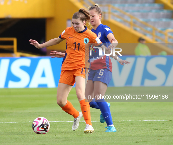 Claire Hutton of the United States and Diana Apollonia Remmers of the Netherlands fight for the ball during the FIFA U-20 Women's World Cup...