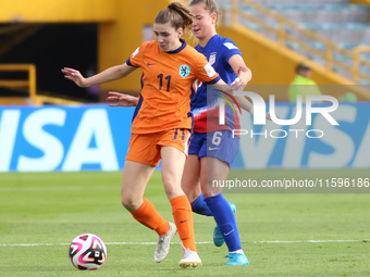 Claire Hutton of the United States and Diana Apollonia Remmers of the Netherlands fight for the ball during the FIFA U-20 Women's World Cup...