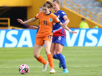 Claire Hutton of the United States and Diana Apollonia Remmers of the Netherlands fight for the ball during the FIFA U-20 Women's World Cup...