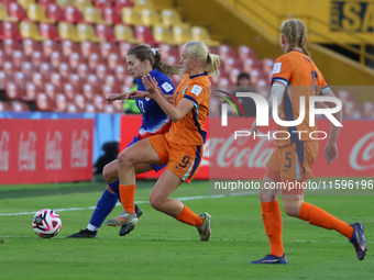 Leah Klenke of the United States and Bo van Egmond of the Netherlands fight for the ball during the FIFA U-20 Women's World Cup third-place...