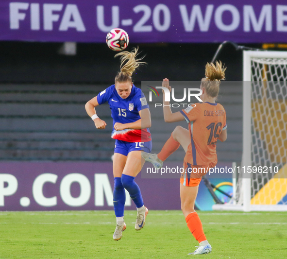 Heather Suzanne Gilchrist of the United States and Eva Elisabeth Geertruida Oude Elberink of the Netherlands fight for the ball during the W...