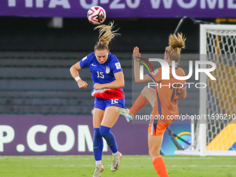 Heather Suzanne Gilchrist of the United States and Eva Elisabeth Geertruida Oude Elberink of the Netherlands fight for the ball during the W...