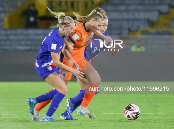 Savannah King and Maddie Dahlien of the United States and Fieke Kroese of the Netherlands fight for the ball during the FIFA U-20 Women's Wo...