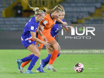 Savannah King and Maddie Dahlien of the United States and Fieke Kroese of the Netherlands fight for the ball during the FIFA U-20 Women's Wo...