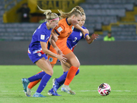 Savannah King and Maddie Dahlien of the United States and Fieke Kroese of the Netherlands fight for the ball during the FIFA U-20 Women's Wo...