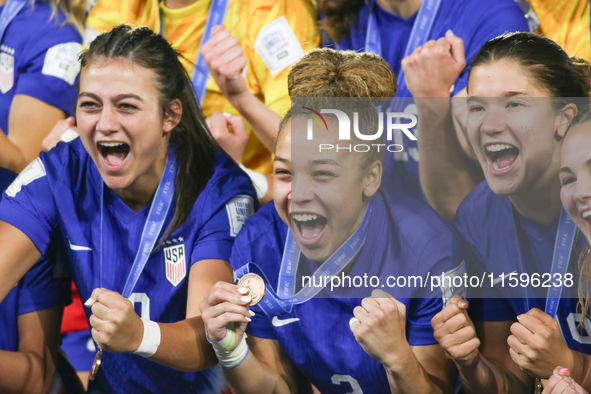 Addison Claire Halpern, Savannah King, and Pietra Tordin of the United States celebrate victory during the FIFA U-20 Women's World Cup Colom...