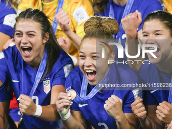 Addison Claire Halpern, Savannah King, and Pietra Tordin of the United States celebrate victory during the FIFA U-20 Women's World Cup Colom...