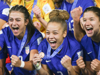 Addison Claire Halpern, Savannah King, and Pietra Tordin of the United States celebrate victory during the FIFA U-20 Women's World Cup Colom...