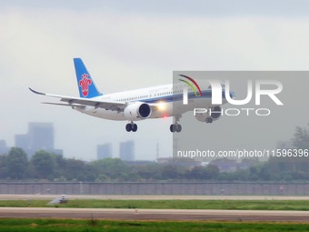 The first C919 passenger plane of China Southern Airlines prepares to land on the runway at Hangzhou Xiaoshan International Airport after ar...