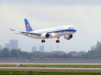 The first C919 passenger plane of China Southern Airlines prepares to land on the runway at Hangzhou Xiaoshan International Airport after ar...