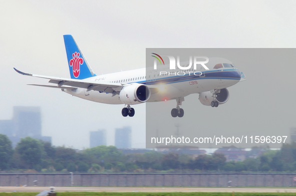 The first C919 passenger plane of China Southern Airlines prepares to land on the runway at Hangzhou Xiaoshan International Airport after ar...