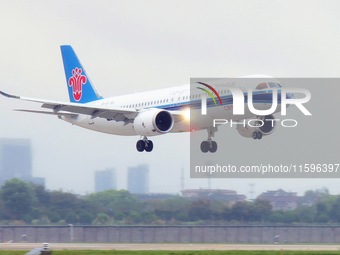 The first C919 passenger plane of China Southern Airlines prepares to land on the runway at Hangzhou Xiaoshan International Airport after ar...