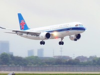 The first C919 passenger plane of China Southern Airlines prepares to land on the runway at Hangzhou Xiaoshan International Airport after ar...