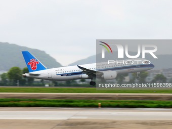 The first C919 passenger plane of China Southern Airlines prepares to land on the runway at Hangzhou Xiaoshan International Airport after ar...