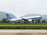 The first C919 passenger plane of China Southern Airlines prepares to land on the runway at Hangzhou Xiaoshan International Airport after ar...