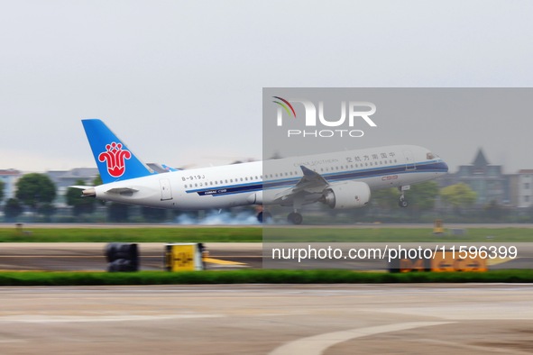 The first C919 passenger plane of China Southern Airlines prepares to land on the runway at Hangzhou Xiaoshan International Airport after ar...