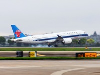 The first C919 passenger plane of China Southern Airlines prepares to land on the runway at Hangzhou Xiaoshan International Airport after ar...