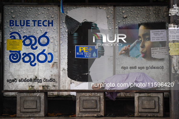 A man sleeps at the bus stop in Colombo, Sri Lanka, on September 22, 2024. A curfew is imposed in Sri Lanka amid the counting of votes in th...