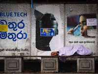 A man sleeps at the bus stop in Colombo, Sri Lanka, on September 22, 2024. A curfew is imposed in Sri Lanka amid the counting of votes in th...