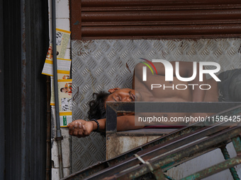 A man sleeps on the cart in Colombo, Sri Lanka, on September 22, 2024. A curfew is imposed in Sri Lanka amid the counting of votes in the pr...