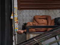 A man sleeps on the cart in Colombo, Sri Lanka, on September 22, 2024. A curfew is imposed in Sri Lanka amid the counting of votes in the pr...