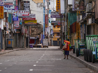 A woman walks on the empty street in Colombo, Sri Lanka, on September 22, 2024. A curfew is imposed in Sri Lanka amid the counting of votes...