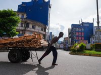 A laborer pulls a cart in Colombo, Sri Lanka, on September 22, 2024. A curfew is imposed in Sri Lanka amid the counting of votes in the pres...