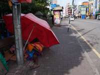 A man sleeps on the street in Colombo, Sri Lanka, on September 22, 2024. A curfew is imposed in Sri Lanka amid the counting of votes in the...