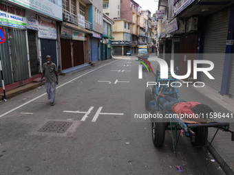 A man sleeps on the cart in Colombo, Sri Lanka, on September 22, 2024. A curfew is imposed in Sri Lanka amid the counting of votes in the pr...