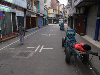 A man sleeps on the cart in Colombo, Sri Lanka, on September 22, 2024. A curfew is imposed in Sri Lanka amid the counting of votes in the pr...