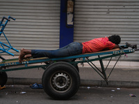 A man sleeps on the cart in Colombo, Sri Lanka, on September 22, 2024. A curfew is imposed in Sri Lanka amid the counting of votes in the pr...