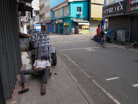 A man sleeps on the cart in Colombo, Sri Lanka, on September 22, 2024. A curfew is imposed in Sri Lanka amid the counting of votes in the pr...